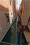 Gondola of venezia berthed along a canal