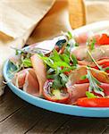 salad with parma ham (jamon), tomatoes and arugula