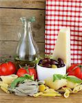 still life of Italian foods ( olive, oil, pasta, cheese )