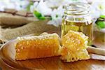 natural organic honey in the comb and  glass jar