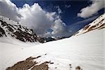 Hiker in snowy mountains. Turkey, Central Taurus Mountains, Aladaglar (Anti-Taurus). Wide angle view.