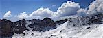 Panorama of snow mountains in sunny day. Turkey, Central Taurus Mountains, Aladaglar (Anti-Taurus), plateau Edigel (Yedi Goller)