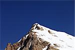 Mountain top with snow and cloudless blue sky in nice day. Turkey, Central Taurus Mountains, Aladaglar (Anti-Taurus). Peak Emler.