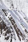 Snowy winter rocks. Caucasus Mountains, Georgia, view from ski resort Gudauri.