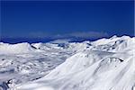 Off-piste slope and snowy plateau at nice day. Caucasus Mountains, Georgia, ski resort Gudauri.