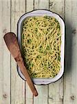 close up of a tray of rustic green pea spaghetti