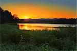 A view of the sun setting behind the famous Blue Mountains Australia, from lagoon at Agnes Banks.  Although a public reserve and recreation area, ithe 78 ha site is also a conservation zone and wildlife refuge