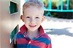 portrait of cute smiling boy at playground