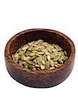 close up of a bowl of pumpkin seeds isolated