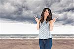 Composite image of smiling attractive brunette posing