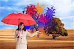 Composite image of happy brunette businesswoman holding umbrella