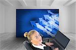 Composite image of blonde businesswoman sitting on swivel chair with laptop