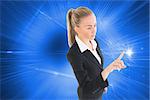 Composite image of blonde businesswoman pointing somewhere