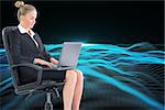 Composite image of blonde businesswoman sitting on swivel chair with laptop