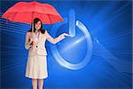 Composite image of happy brunette businesswoman holding umbrella