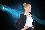 Composite image of blonde businesswoman standing with hands on hips