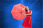 Composite image of elegant happy blonde holding umbrella