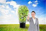 Composite image of smiling asian businesswoman pointing