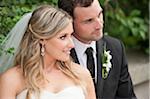 Close-up portrait of bride and groom sitting outdoors on Wedding Day, Canada