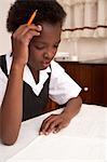 Girl studying, head in hands