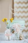 Still life of celebration cake with flowers and decoration