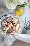 Still life of macaroons with flowers and decoration