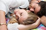 Close up of couple relaxing on bed