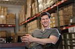 Worker sitting in warehouse