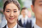 Smiling Young Businesswoman Looking at Camera