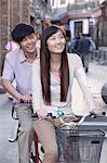 Young Heterosexual Couple on a Tandem Bicycle in Beijing