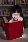 Girl Surprised By Glowing Book