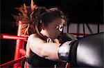 Close up of female boxer throwing a punch, hair in motion