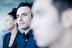 Young businessman sitting in a business meeting with colleagues