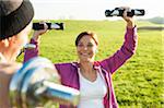 Man and Woman Lifting Weights Outdoors, Baden-Wurttemberg, Germany