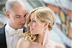 Close-up portrait of bride and groom looking at each other outdoors on Wedding Day, Canada