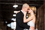 Bride and groom embracing at wedding venue on Wedding Day, Canada