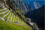 Close-up of terraced mountain side with stone walls, Machu Picchu, Peru