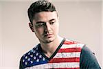 Portrait of Young Man wearing American Flag Tee Shirt, Studio Shot