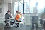 Businesspeople having meeting at conference table