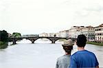 Couple looking at Ponte alle Grazie, Florence, Tuscany, Italy