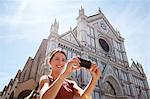 Woman outside Santa Croce church, Piazza di Santa Croce, Florence, Tuscany, Italy