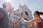 Man and woman photogrpahing Church of Santa Croce, Piazza di Santa Croce, Florence, Tuscany, Italy