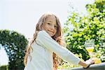 Portrait of girl looking at camera, smiling