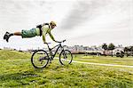 Cyclist balancing body on bike