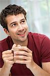 Young man taking coffee break