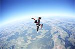 Female skydiver free falling above Leutkirch, Bavaria, Germany