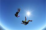 Skydivers upside down above Leutkirch, Bavaria, Germany