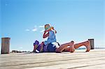 Female toddler and father on jetty, Utvalnas, Gavle, Sweden