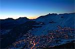 Town in mountains at night, Verbier, Switzerland