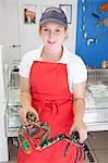 Woman holding fresh lobsters